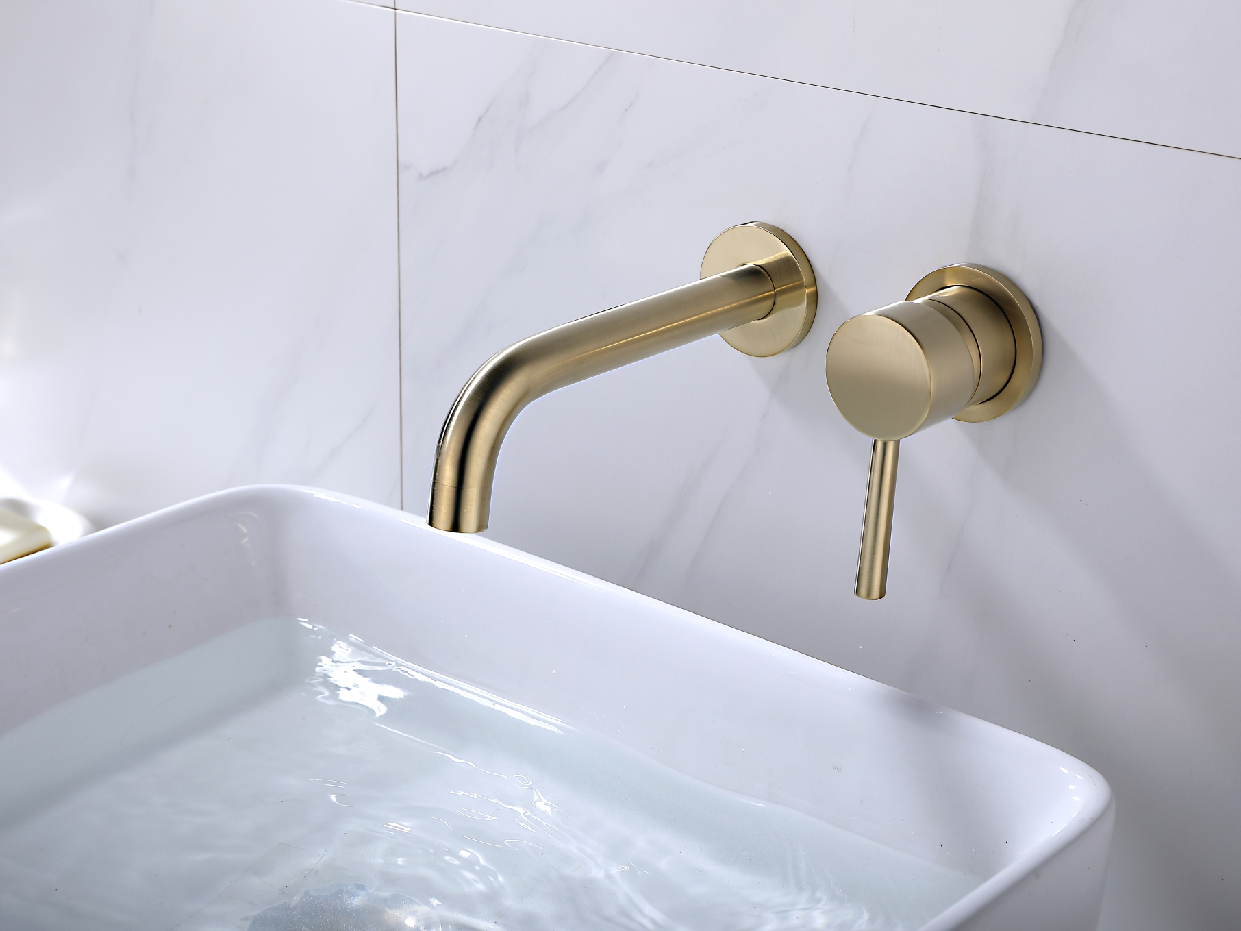 Brushed gold wall mounted basin mixer
